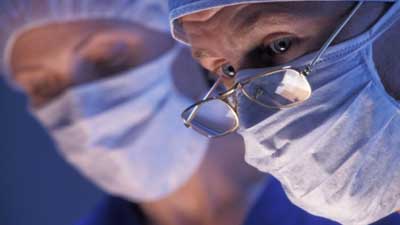 surgeons operating - NHS privatisation